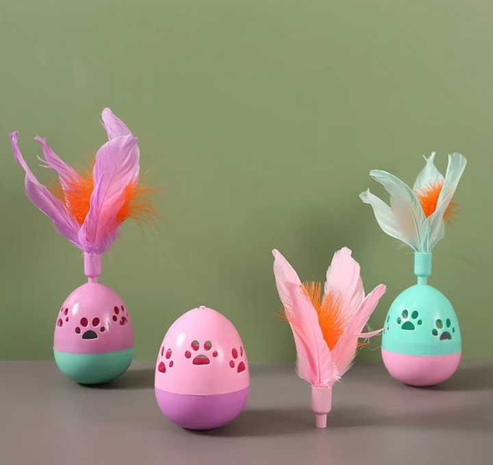 Bright multi-color pet toy ball with feathers, ideal for interactive play.