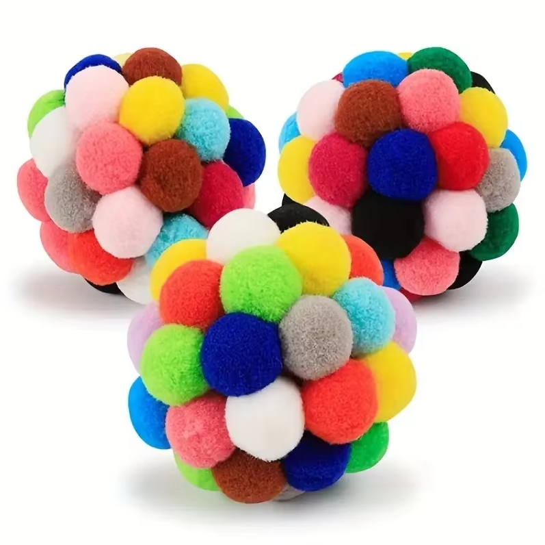 Vibrant Pompom Cat Play Balls. Soft, bouncy, and interactive pet toy assortment for cats and kittens' active play.