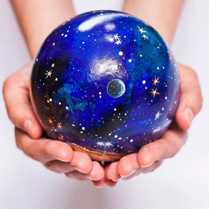 Detailed wooden models of planets like Jupiter & Earth from the solar system learning set, a fun science toy.