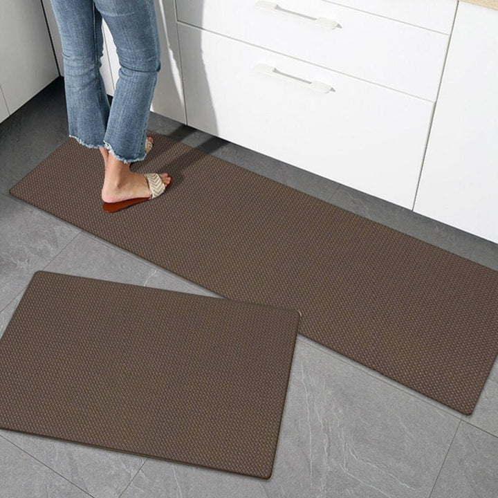 Comfort anti-slip waterproof kitchen rug, PVC cushioned floor mat for home safety & kitchen decor.