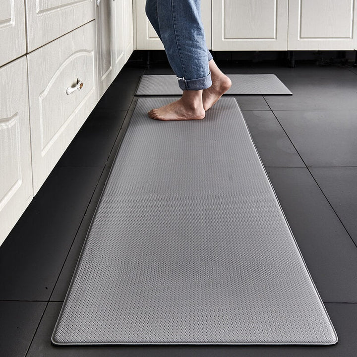 Ergonomic comfort mat for kitchen, anti-fatigue, anti-slip, & waterproof, ideal for standing tasks.