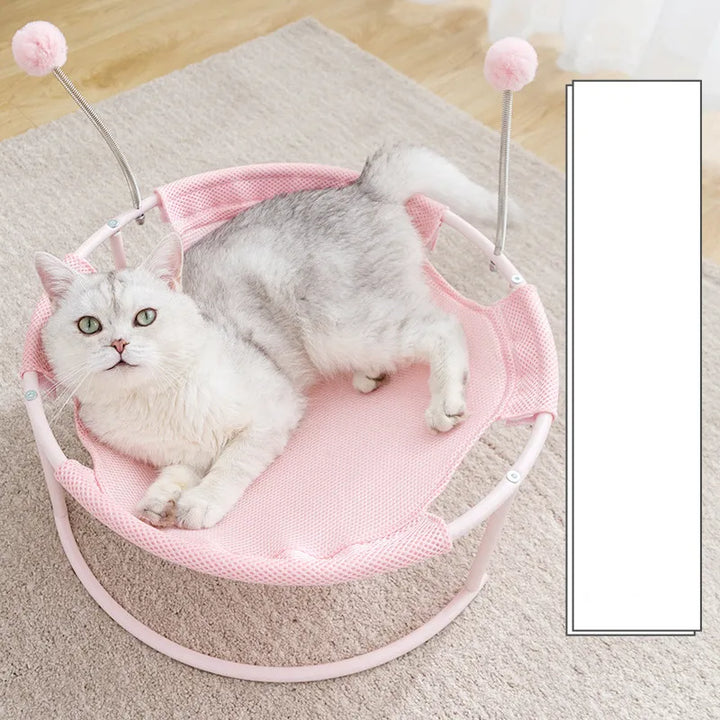 Interactive cat hammock with dangling play balls. A cozy pet bed & lounger for playful, comfortable cats.