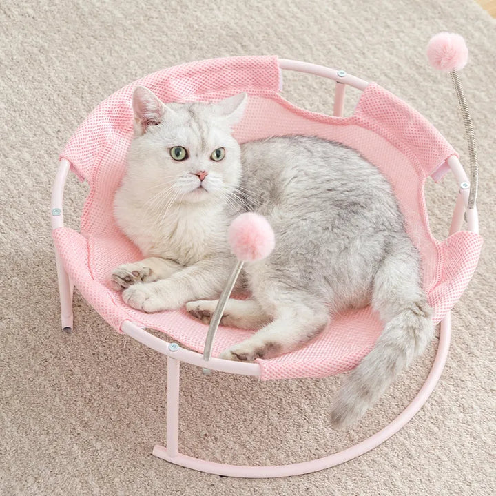 Sturdy round cat hammock, a cozy pet furniture piece with a soft sleeping area for relaxed, happy cats.