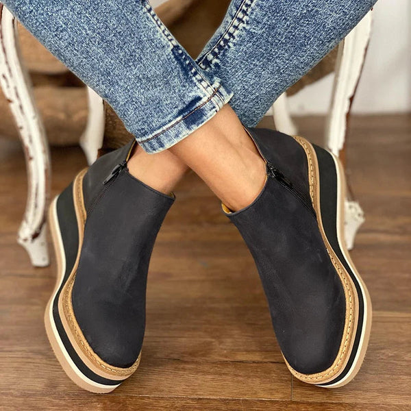 Stylish black wedge heel ankle boots for women, offering all-day comfort and support