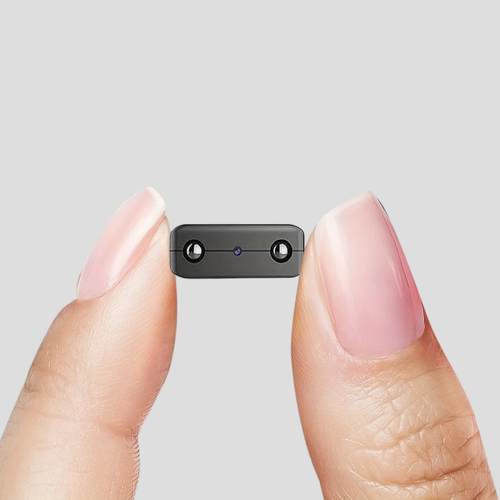 Compact Mini Full HD surveillance camera with night vision & motion detection for discreet home security.