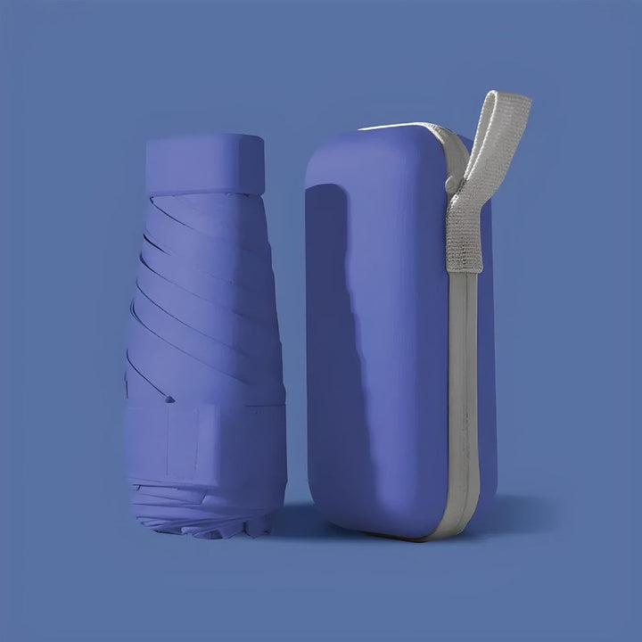 Compact travel umbrella, closed, illustrating its small size for easy storage, with waterproof case