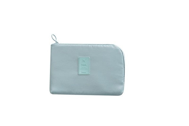 Unisex waterproof electronics & cable organizer with free mini storage case.