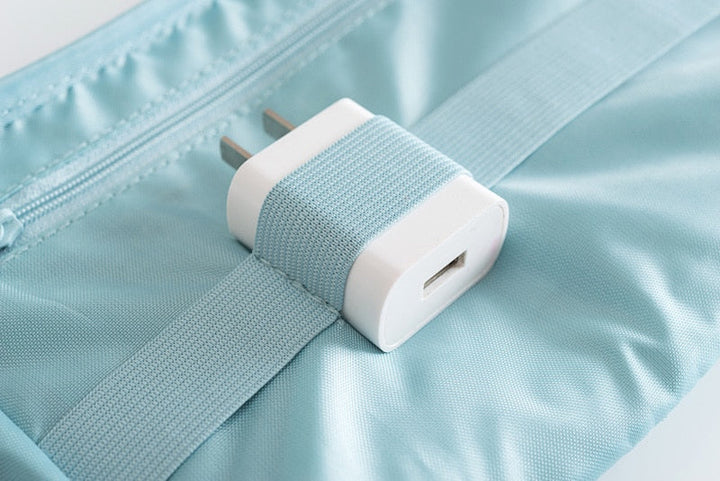 Compact waterproof electronics organizer for efficient cable management & travel.