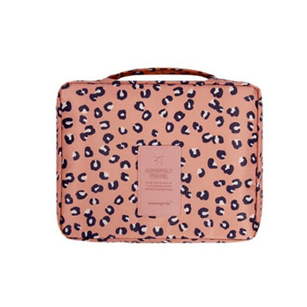 Dark blue floral waterproof cosmetic organizer, compact for women's travel needs.