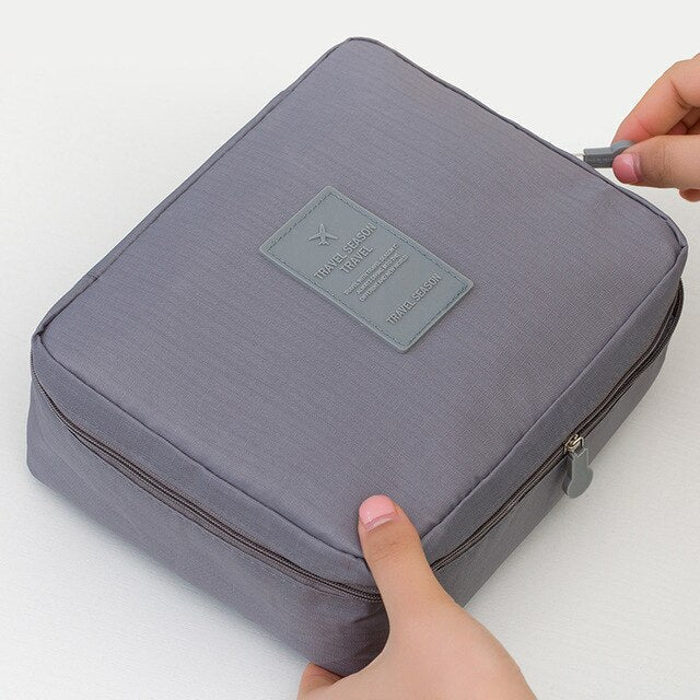 Compact waterproof makeup organizer for women, ideal for travel and daily use.