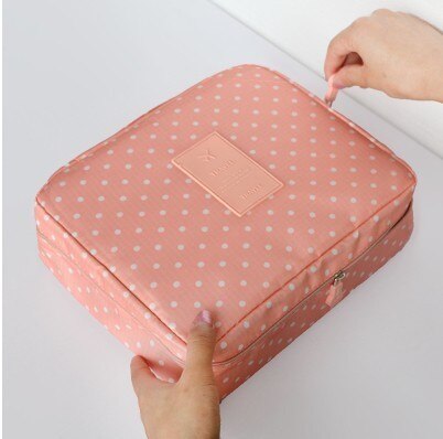 Women's travel makeup organizer, compact and waterproof, with stylish dark blue flowers.