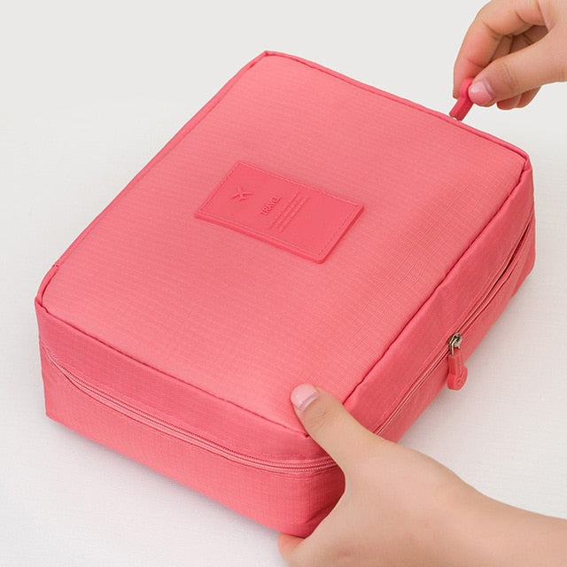 Dark blue floral waterproof makeup organizer, perfect for women's beauty travel storage.