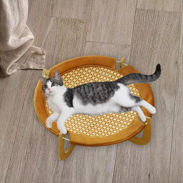 Cooling rattan cat hanging mat. Elevated summer pet bed hammock for feline comfort.