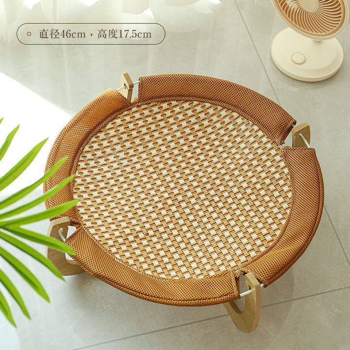 Stylish cooling rattan cat hammock. This elevated summer pet bed offers comfort and a cool resting spot.