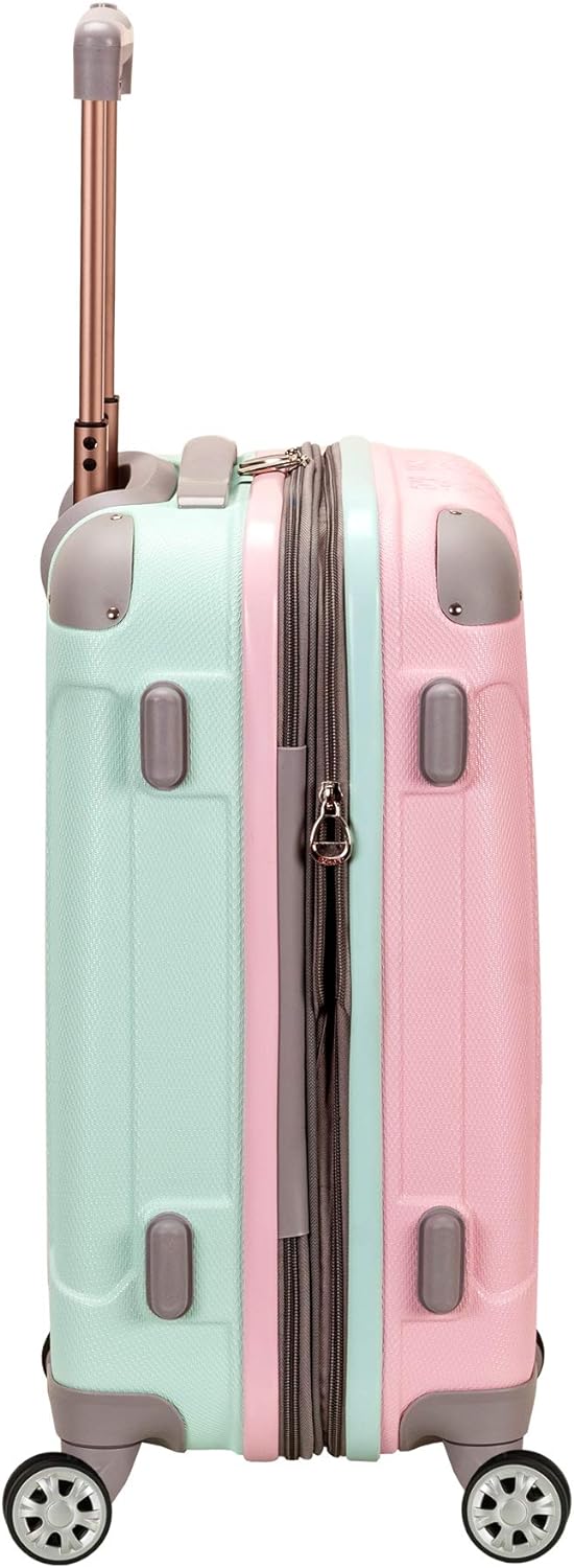 Unisex lightweight hardside carry-on luggage in Cotton Candy pink. Expandable travel bag with double spinner wheels.