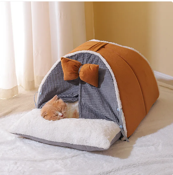 Cozy arch design cat house with a charming bow, perfect for a feline retreat. Soft, washable pet bed for indoor cats.