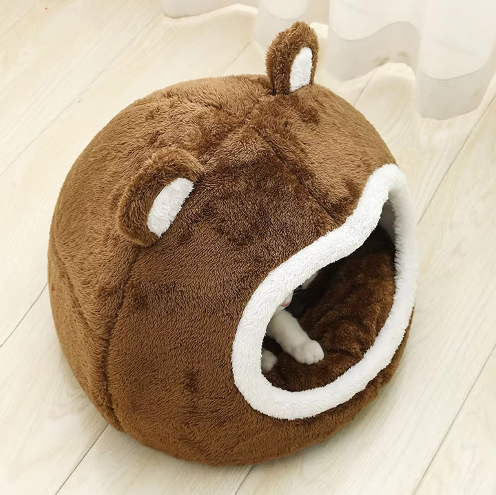 Fluffy, washable pet bed, a cozy cat cave for comfort. Features a non-slip base for stability. Ideal for any cat.