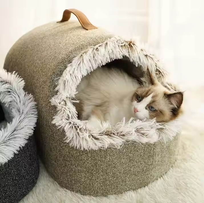 Cozy cat house bed with a fluffy edge, offering ultimate pet comfort & a peaceful sleep retreat.