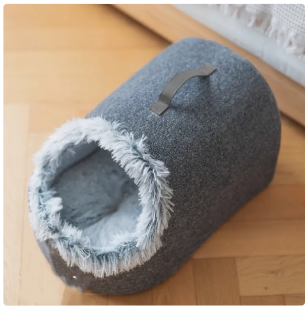 Warm cat house bed with a soft, plush rim, designed for maximum pet comfort & a quiet cat retreat.