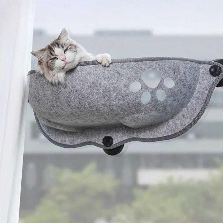 Cozy cat window hammock with strong suction cups, a perfect sunbathing perch and comfortable pet bed for indoor felines.