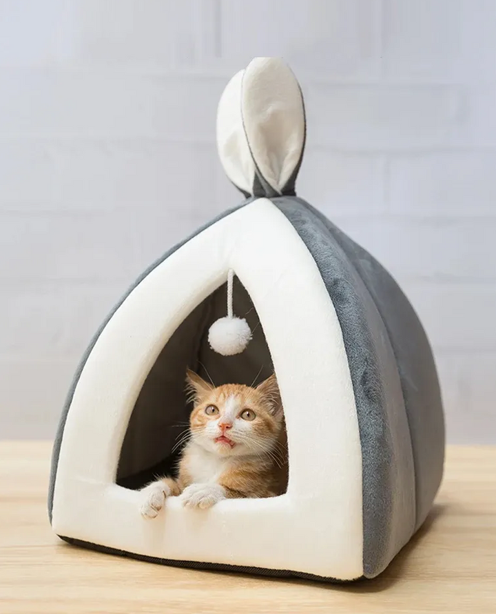 Cozy cave cat bed for ultimate pet comfort with an integrated play ball.