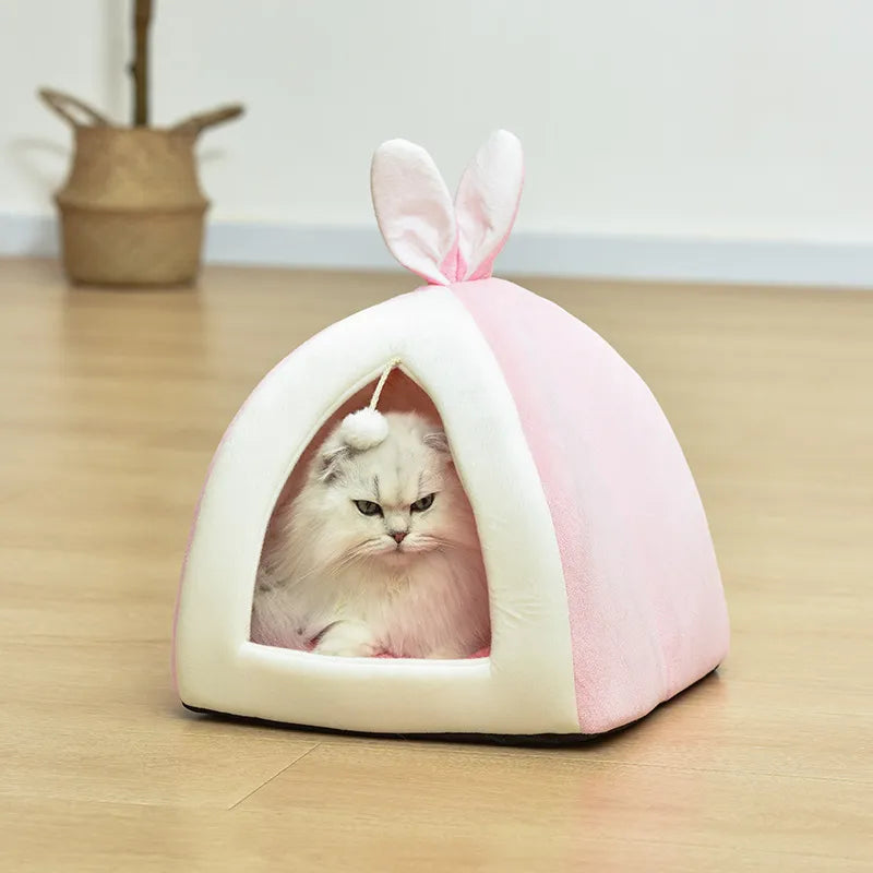 Small gray cat bed cave, warm & cozy, includes a fun play ball. Perfect pet comfort accessory.