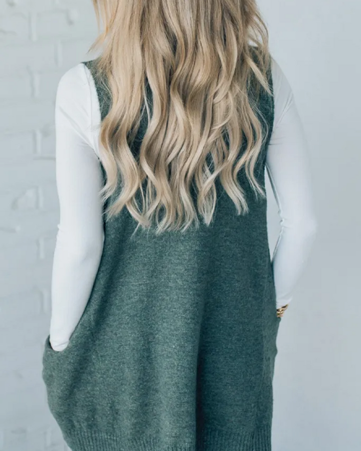 Front view of a comfy women's knit vest with pockets, ideal for fall/winter