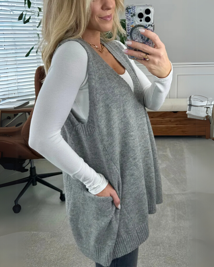 Warm, cozy women's knit vest with spacious pockets, versatile sleeveless jacket