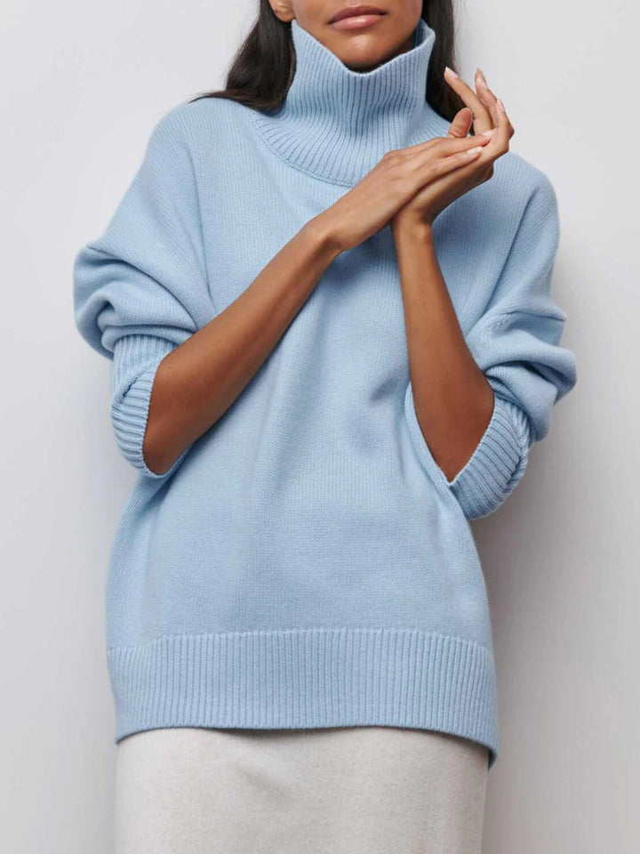 Cozy knit women's oversized turtleneck sweater in relaxed fit, perfect for winter fashion.