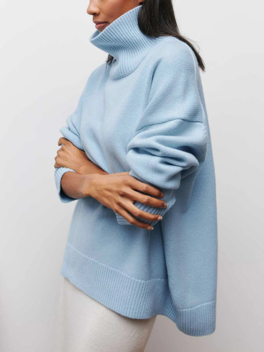 Soft women's relaxed fit turtleneck sweater, an essential for a layered fall look.