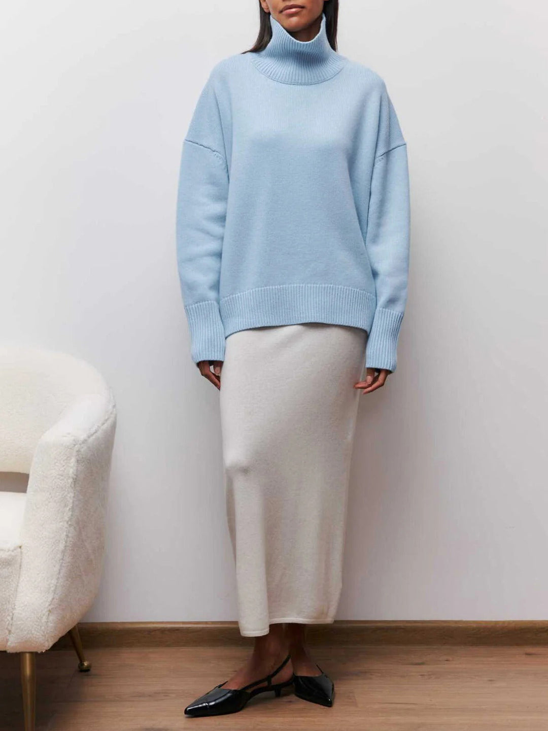 Warm women's turtleneck sweater with relaxed fit, great for chilly fall and winter days.