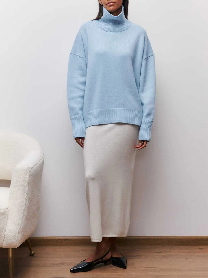 Warm women's turtleneck sweater with relaxed fit, great for chilly fall and winter days.