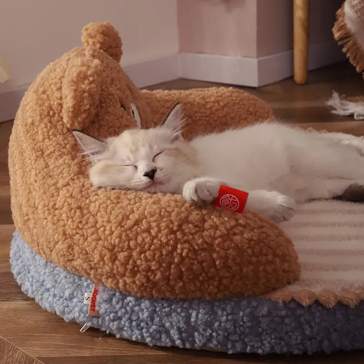 Cute bear-shaped pet bed with a soft backrest, ideal for cats and small dogs seeking comfort and warmth.
