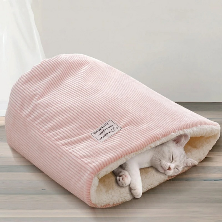 Cozy SnowPaws winter warming cat bed, perfect for feline comfort & warmth. Soft, washable pet furniture for cats.