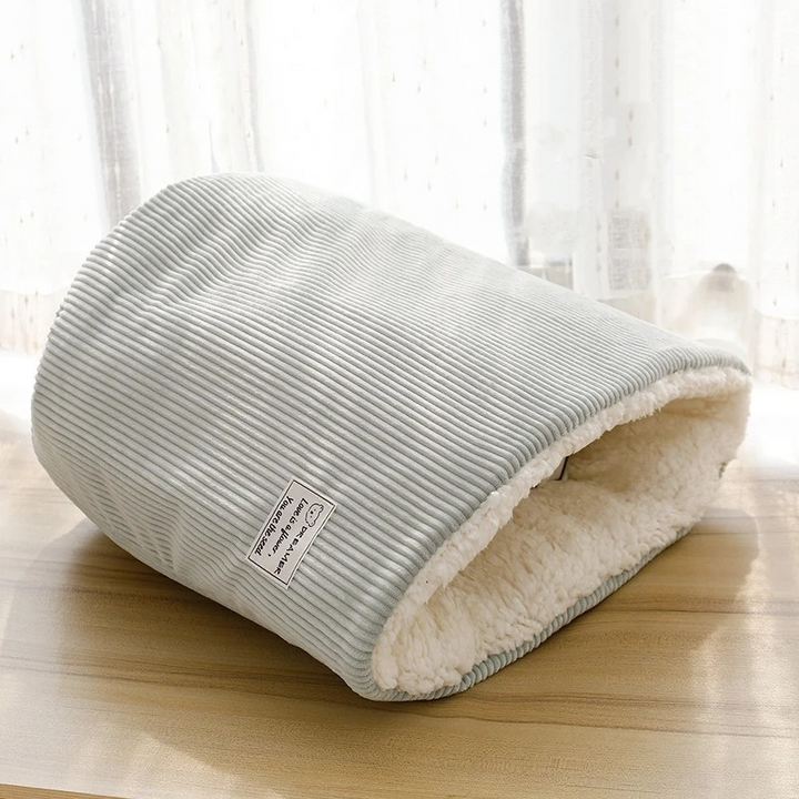 Plush SnowPaws winter warming cat bed, providing cozy comfort. Washable pet furniture for a warm feline retreat.