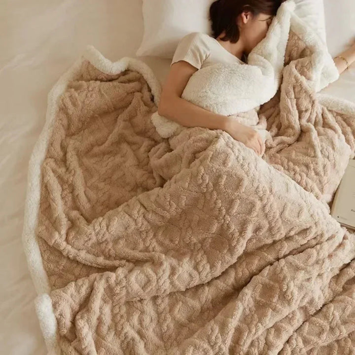 New cozy winter bedding blanket, folded neatly, showcasing its thickness and inviting comfort