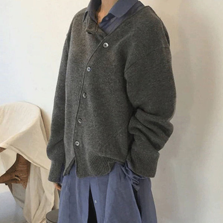 Model wearing a cream women's button knit winter sweater, paired with jeans for a casual look.