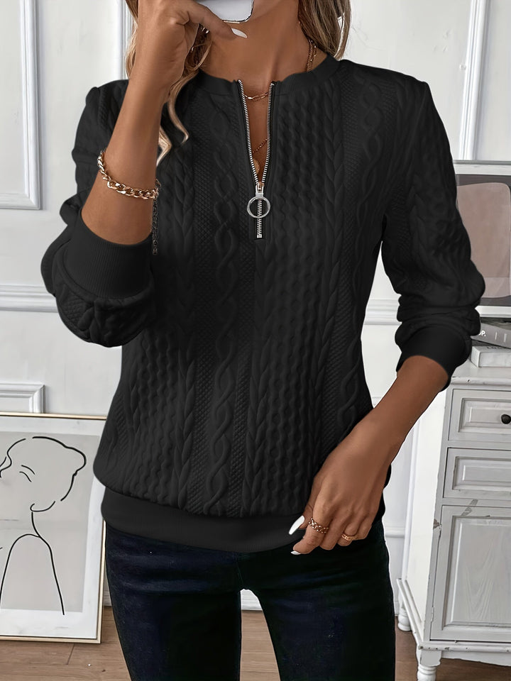 Front view of a classic women's cream cable knit zip-up jumper for effortless casual style.