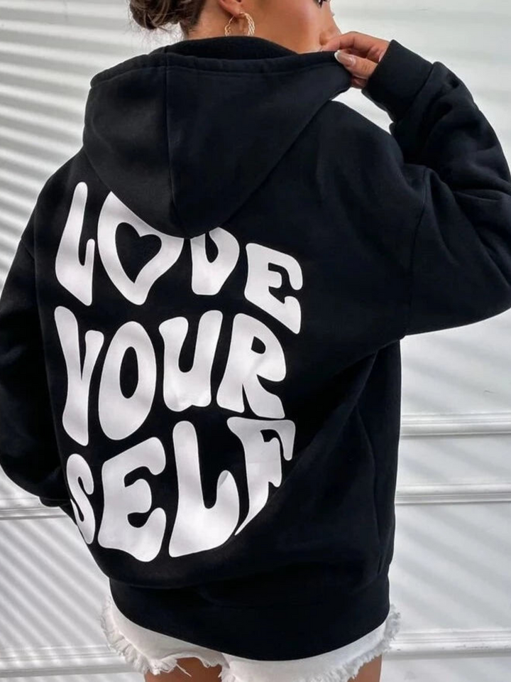 Casual women's hoodie, a warm and cozy winterwear staple featuring a practical kangaroo pocket.