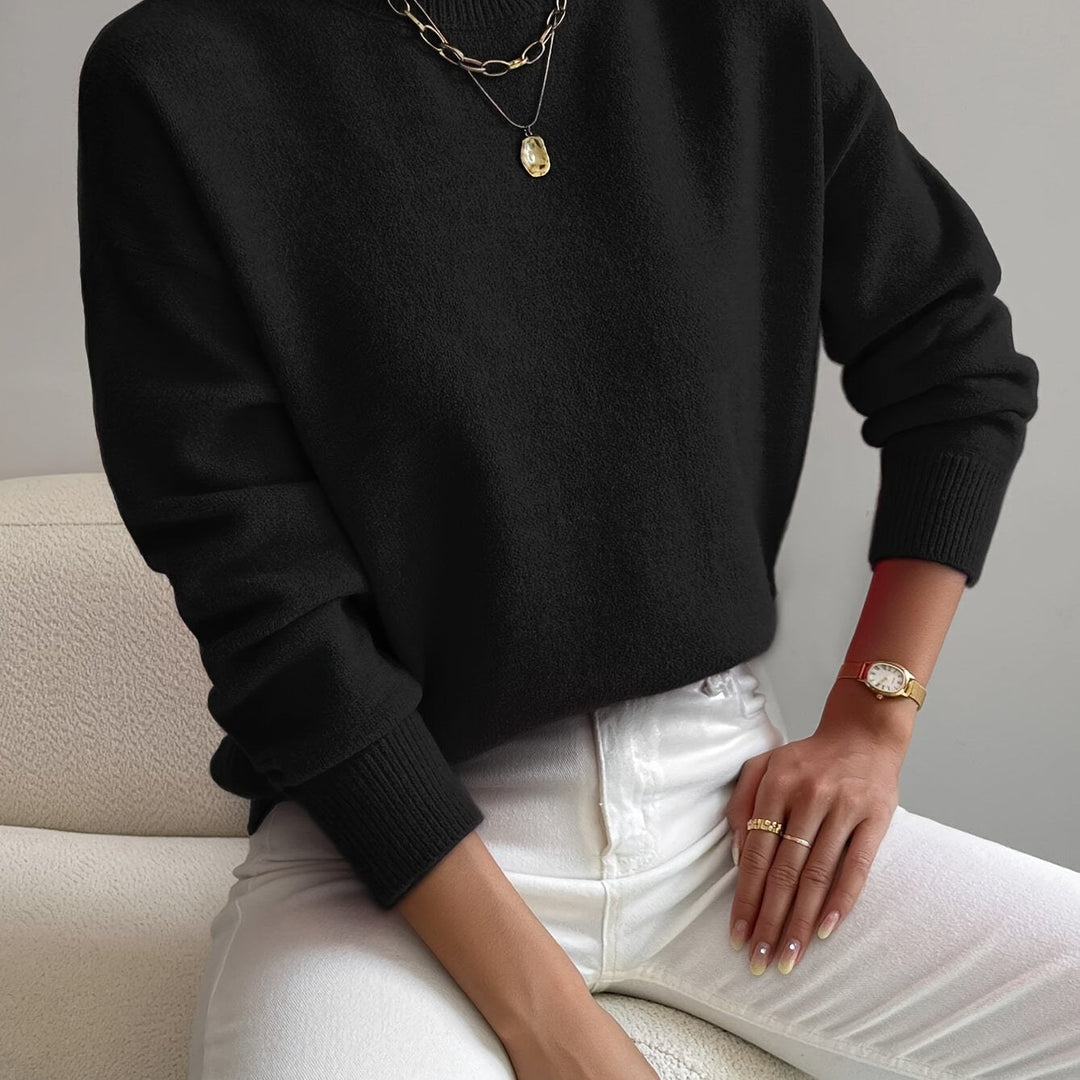 Stylish high neck knit jumper for women, warm long sleeve pullover for winter and autumn wear.