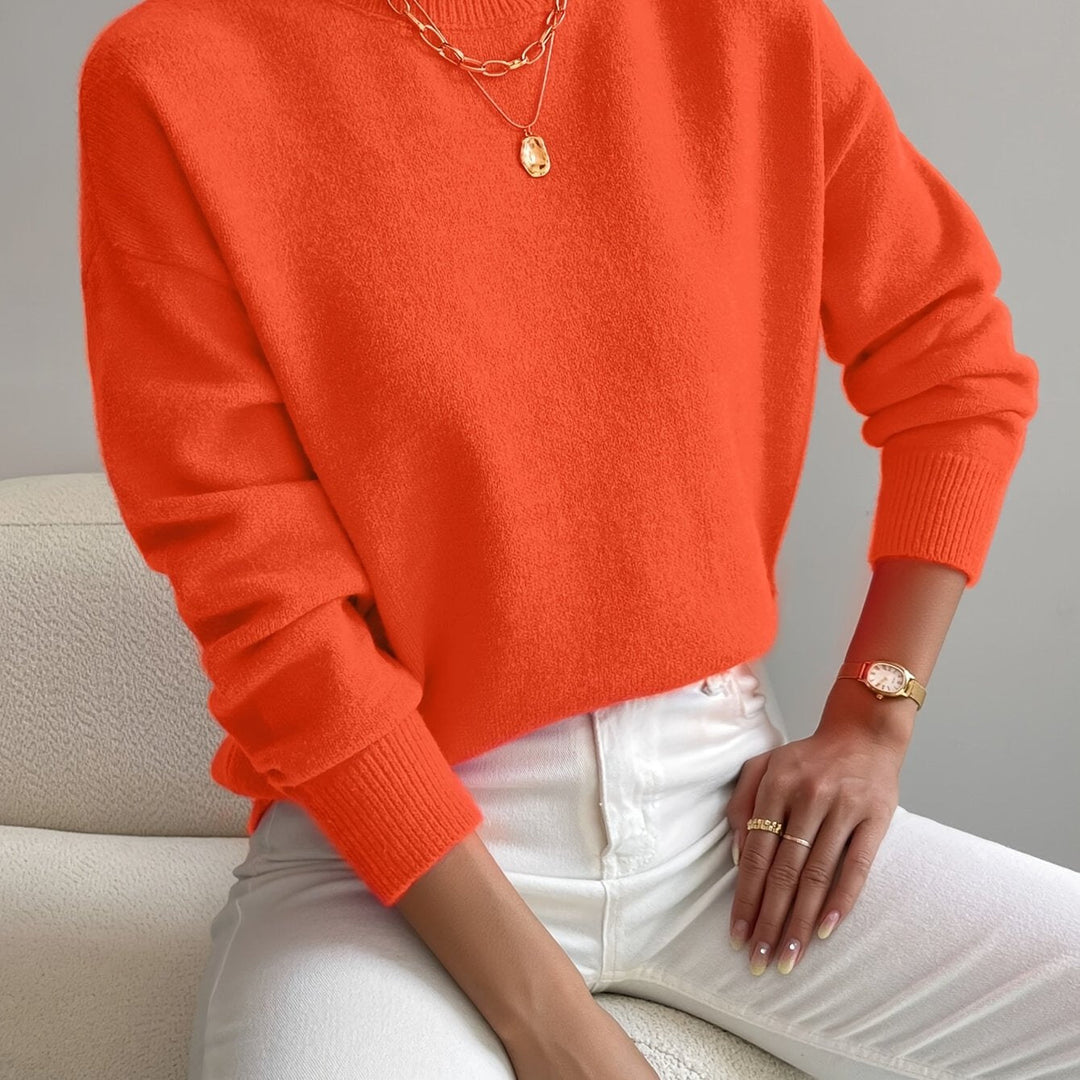 Comfortable soft knit high neck jumper for women, warm long sleeve pullover for winter style.