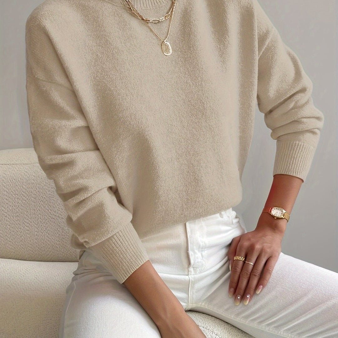 Textured knit high neck jumper, soft long sleeve pullover for women's winter fashion.