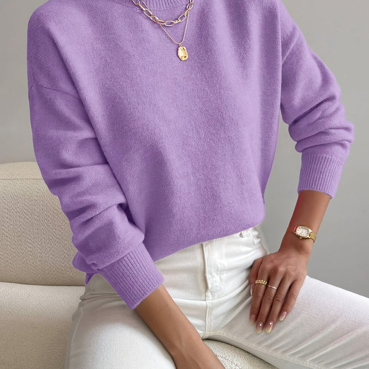 Casual high neck knit jumper for ladies, cozy long sleeve pullover for everyday winter style.