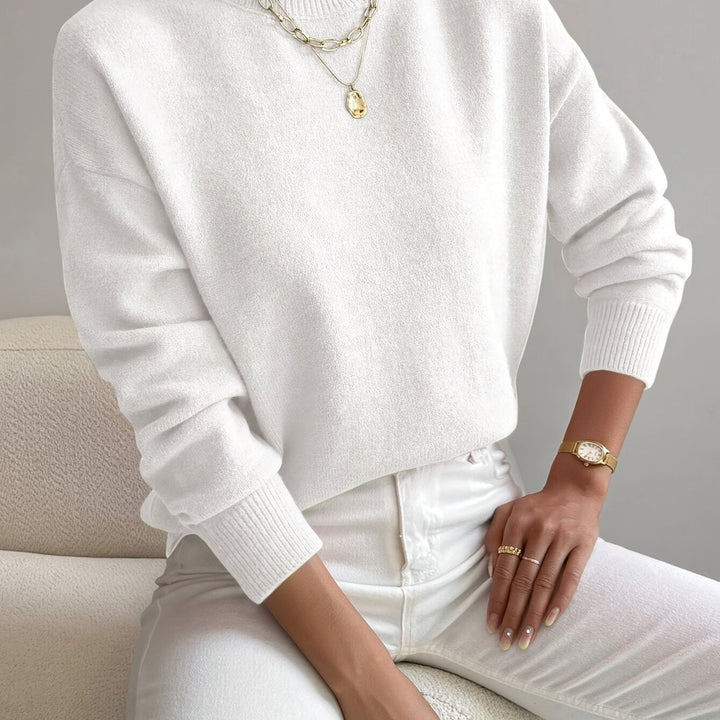 Autumn women's high neck knit jumper, warm long sleeve sweater for crisp fall weather.