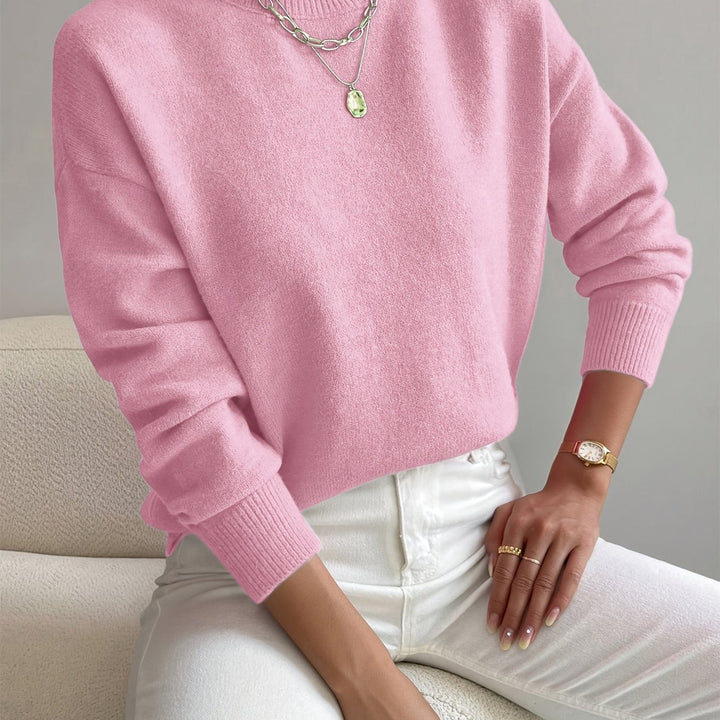 Winter women's high neck knit pullover, cozy long sleeve sweater for cold weather fashion.