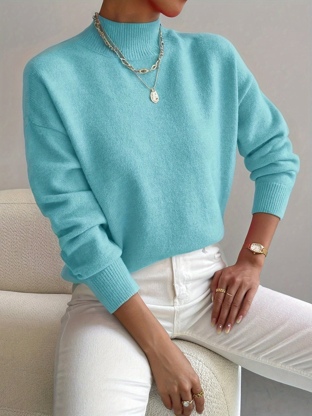 Trendy women's high neck knit sweater, stylish long sleeve pullover for fashionable fall outfits.