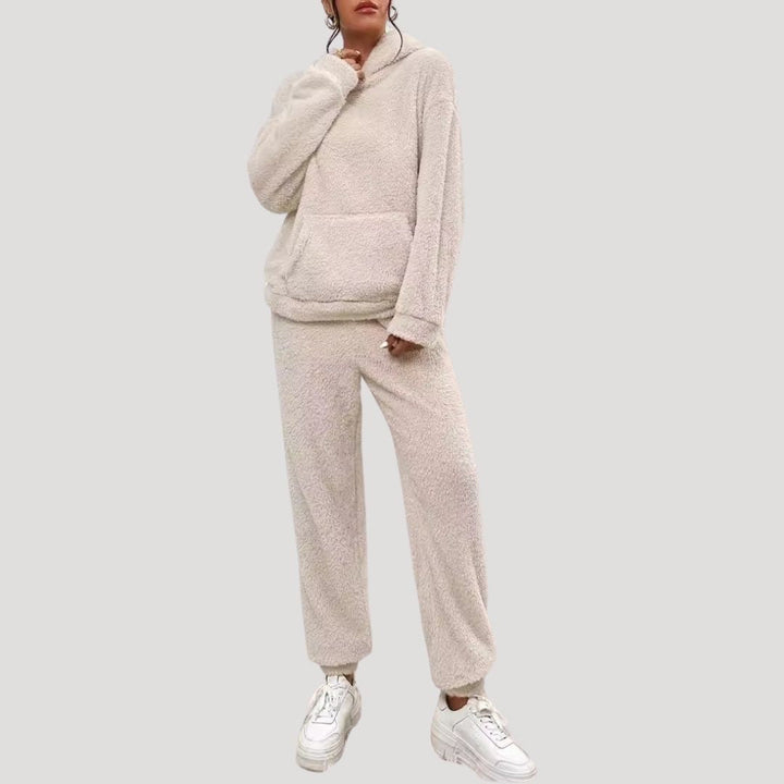 Folded women's hoodie set and lounge pants, showcasing the cozy fabric and practical two-piece design.