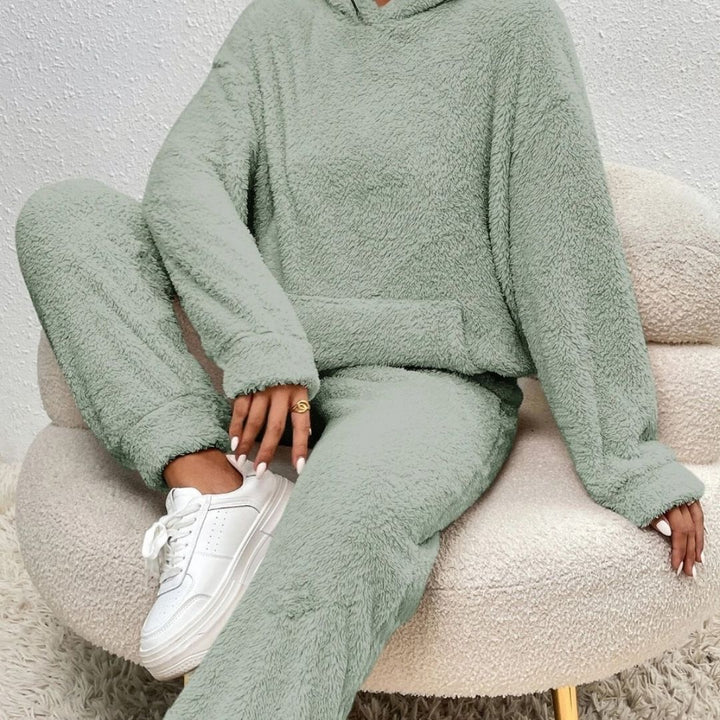 Spring fashion women's cozy outfit: hooded top and comfortable lounge pants in a light grey knit.