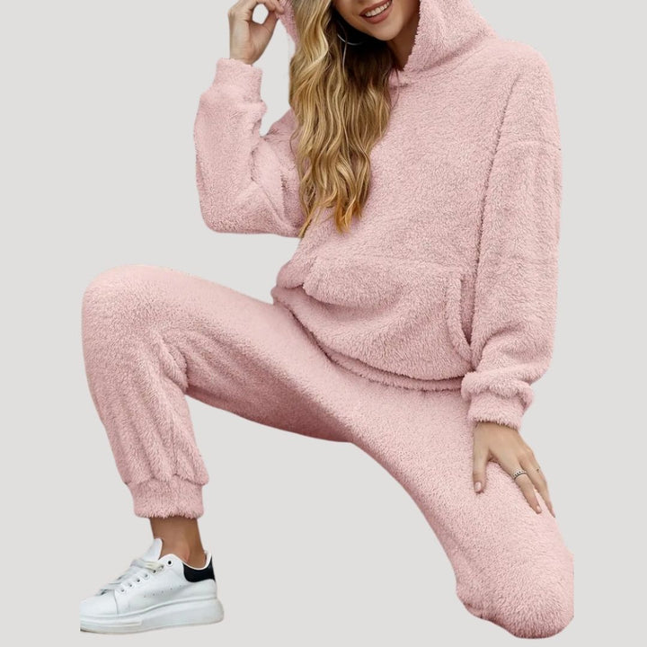 Stylish women's casual wear: a two-piece hooded top and lounge pants set in a vibrant blue hue.