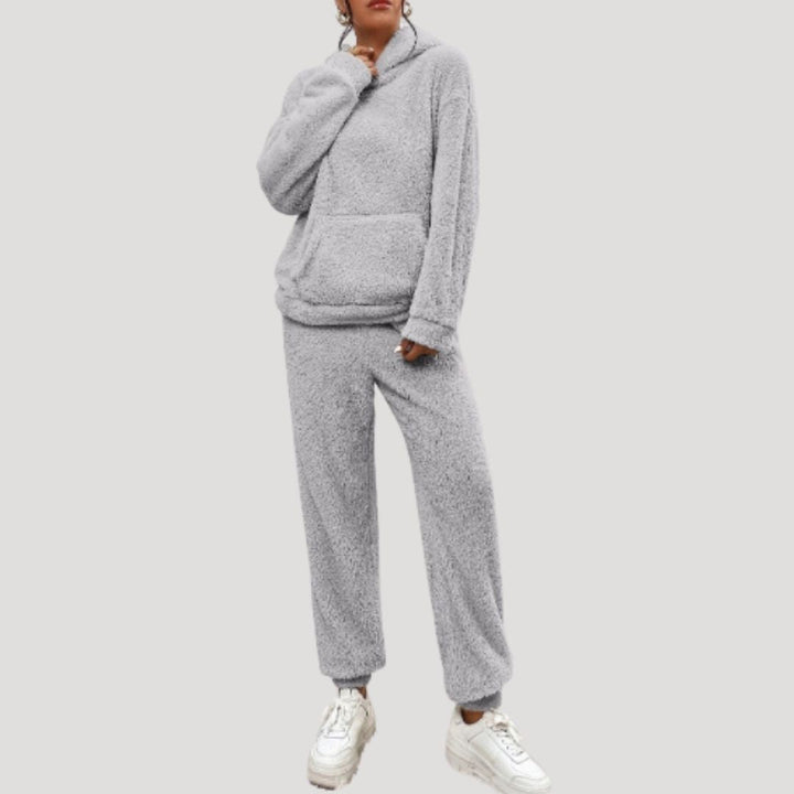 Women's comfortable clothing set featuring a long-sleeve hooded top and elastic waist lounge pants.